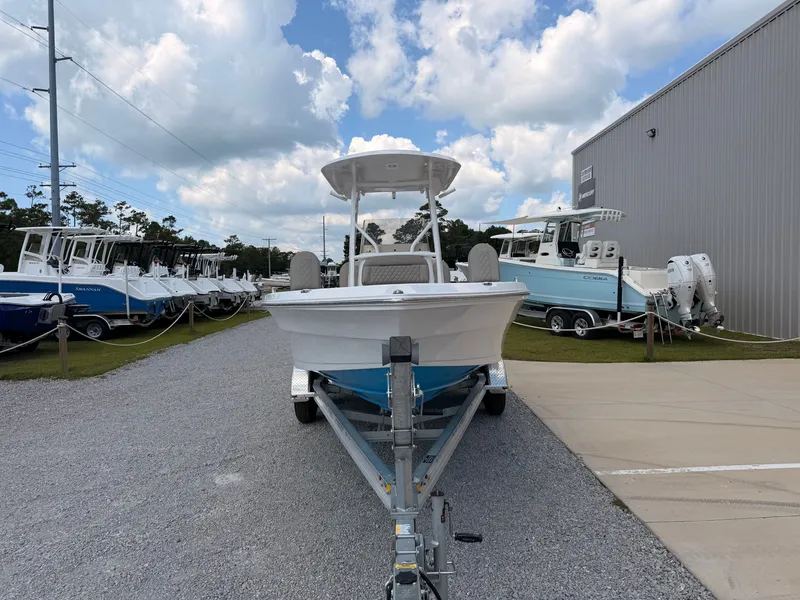 Slide: The Image of A 2027 Savannah 210X boat on a trailer in front of a building. - 6