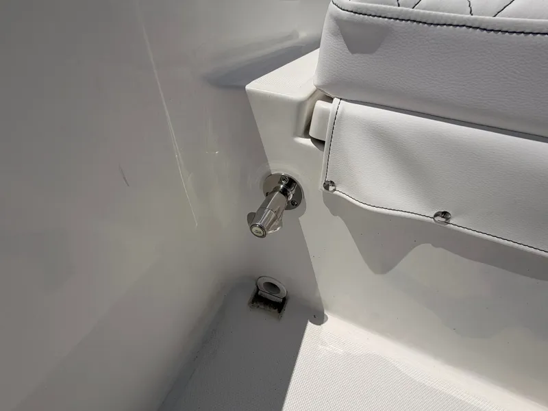 Slide: The Image of Close-up of a white boat seat with a metal handle on the side. - 15