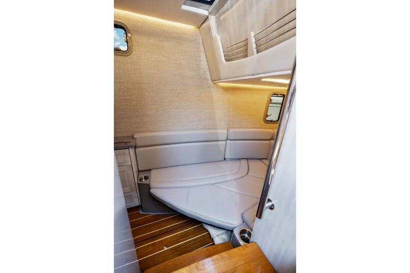 Slide: The Image of Luxurious interior cabin of 2023 HCB 42 Lujo boat with elegant seating and wood flooring. - 54