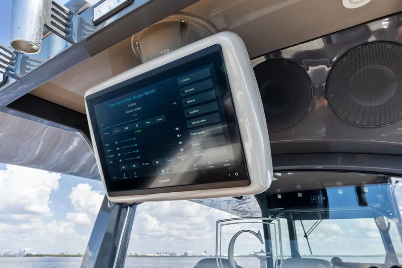 Slide: The Image of Touchscreen display on 2023 HCB 42 Lujo boat, showing audio controls. - 36