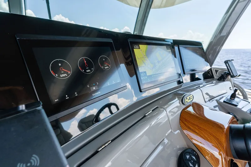 Slide: The Image of Helm of 2023 HCB 42 Lujo boat with advanced navigation displays. - 50