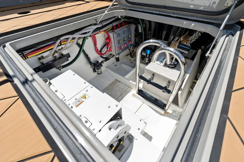 Slide: The Image of Engine compartment of 2023 HCB 42 Lujo boat, showcasing wiring and mechanical components. - 62