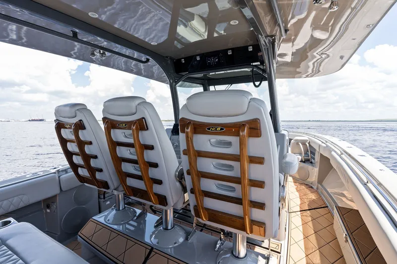 Slide: The Image of 2023 HCB 42 Lujo boat interior with luxurious seating and ocean view. - 43