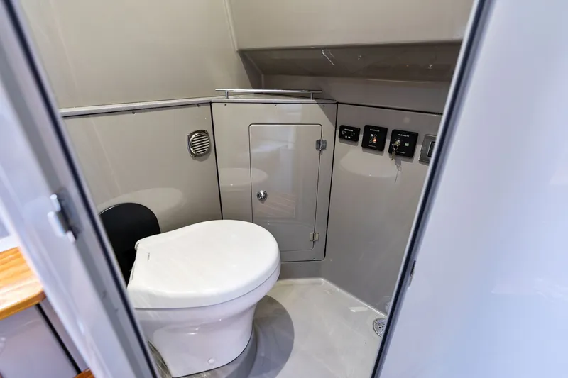Slide: The Image of Modern bathroom interior on 2023 HCB 42 Lujo boat, featuring sleek design and controls. - 53