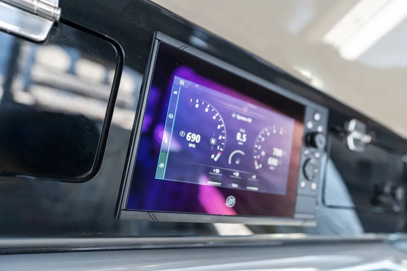 Slide: The Image of Dashboard of 2023 HCB 42 Lujo boat displaying digital gauges and controls. - 52