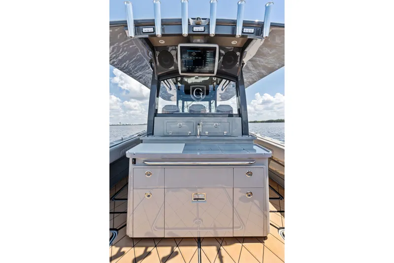 Slide: The Image of 2023 HCB 42 Lujo boat interior with sleek cabinetry and advanced navigation system. - 34