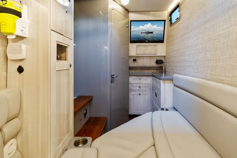 Slide: The Image of Interior of 2023 HCB 42 Lujo boat with modern seating and cabinetry. - 55