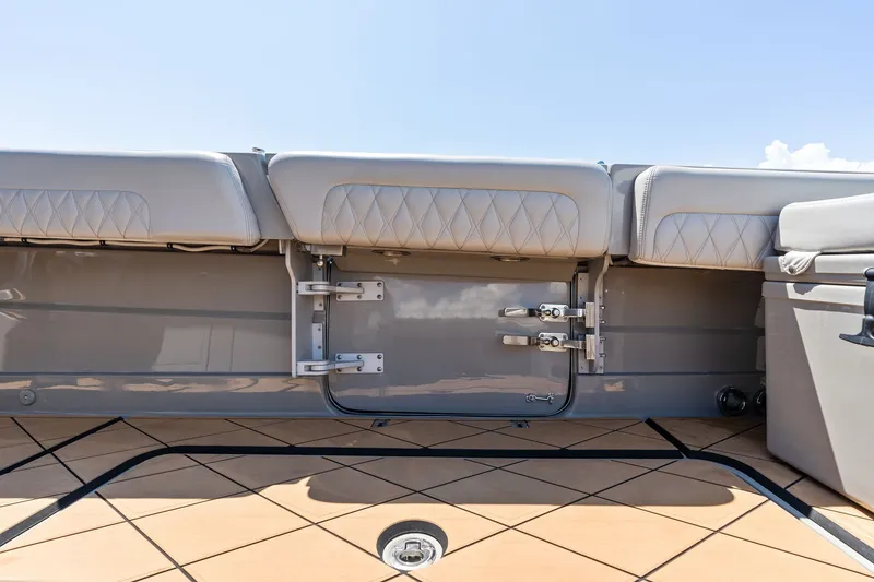 Slide: The Image of 2023 HCB 42 Lujo boat interior with cushioned seating and sleek design. - 30