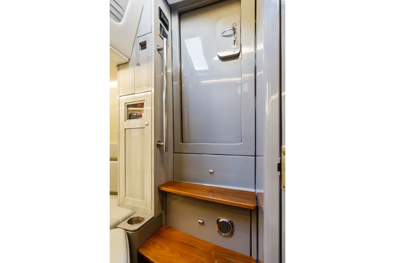 Slide: The Image of Interior of 2023 HCB 42 Lujo boat featuring sleek design and wooden steps. - 58