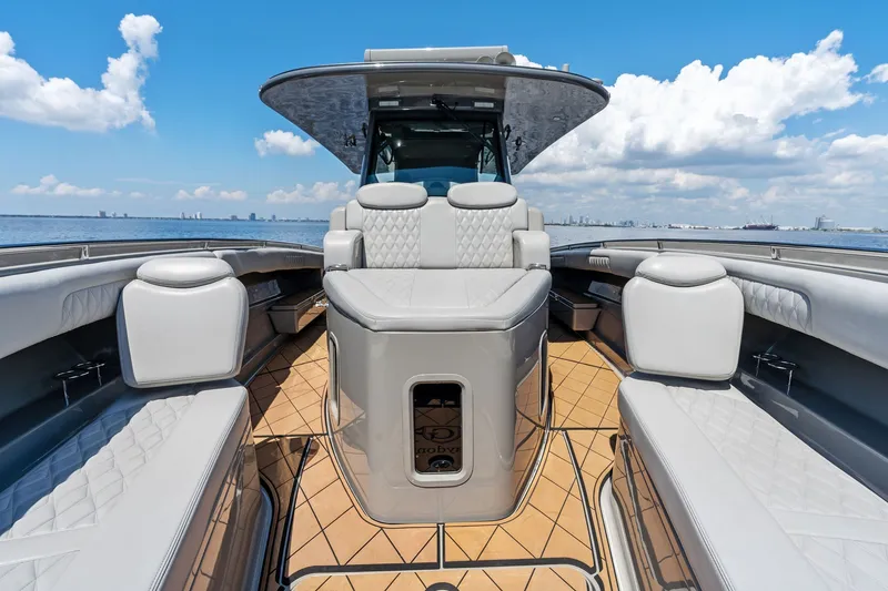 Slide: The Image of 2023 HCB 42 Lujo luxury boat interior with plush seating and ocean view. - 19