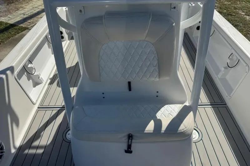 Slide: The Image of 2018 Blue Wave 2400 PureBay boat interior with white cushioned seating and sleek design. - 40