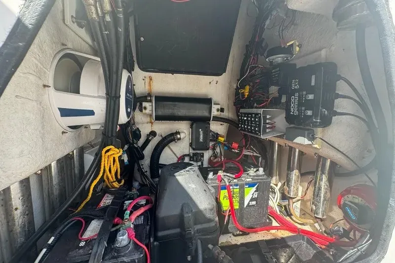 Slide: The Image of Interior view of a 2018 Blue Wave 2400 PureBay boat's electrical and mechanical components. - 63