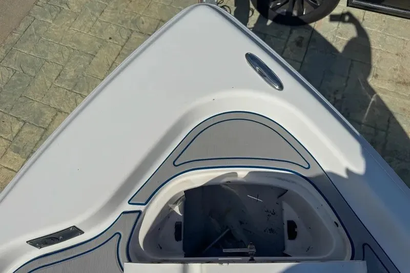 Slide: The Image of Bow of a 2018 Blue Wave 2400 PureBay boat with open storage compartment. - 30