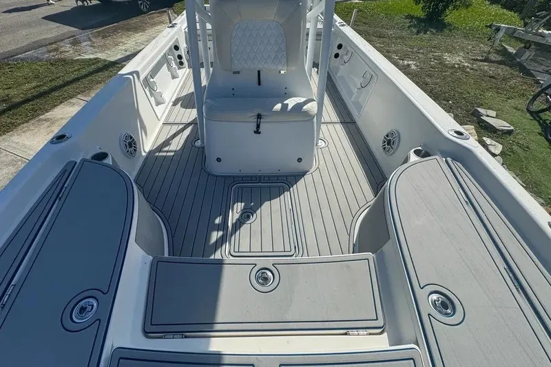 Slide: The Image of 2018 Blue Wave 2400 PureBay boat interior with sleek seating and storage compartments. - 35