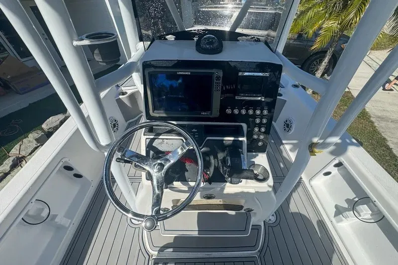 Slide: The Image of Center console of a 2018 Blue Wave 2400 PureBay boat with navigation equipment. - 20