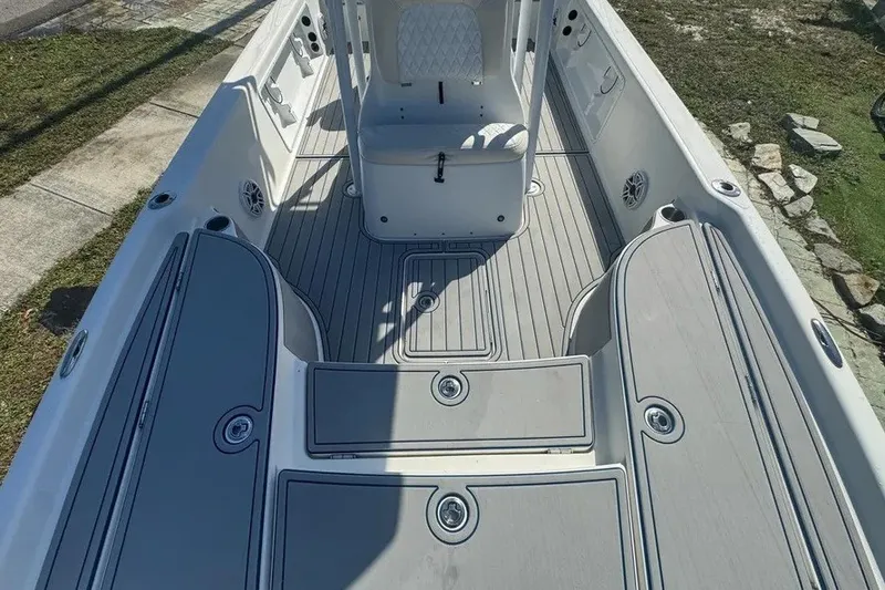 Slide: The Image of 2018 Blue Wave 2400 PureBay boat interior with spacious deck and seating. - 34