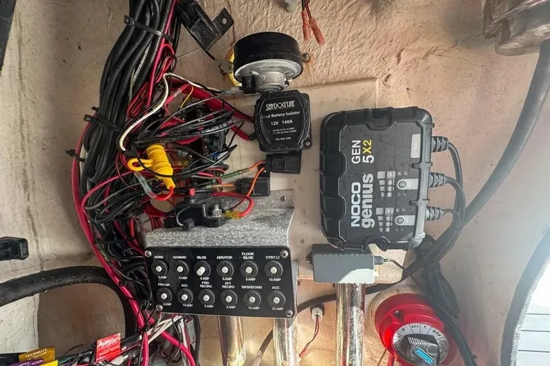Slide: The Image of Electrical system setup in a 2018 Blue Wave 2400 PureBay boat, featuring wiring and battery components. - 67