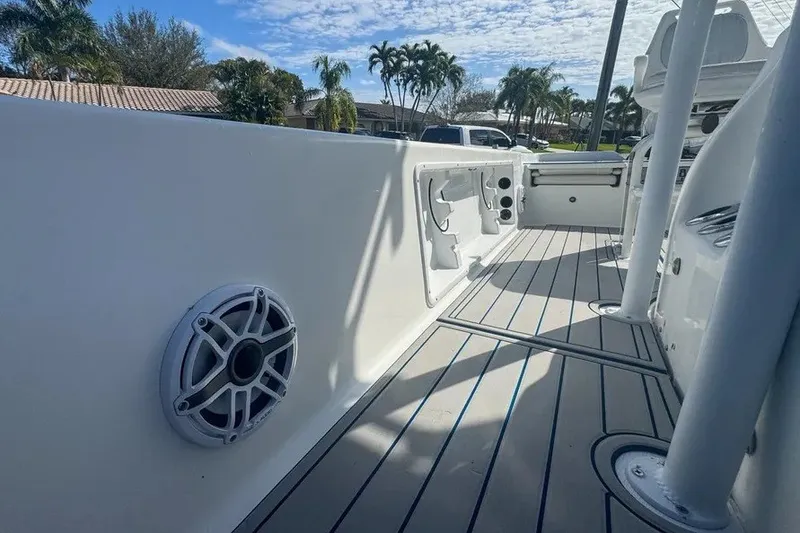 Slide: The Image of 2018 Blue Wave 2400 PureBay boat interior with speaker and storage compartments. - 56