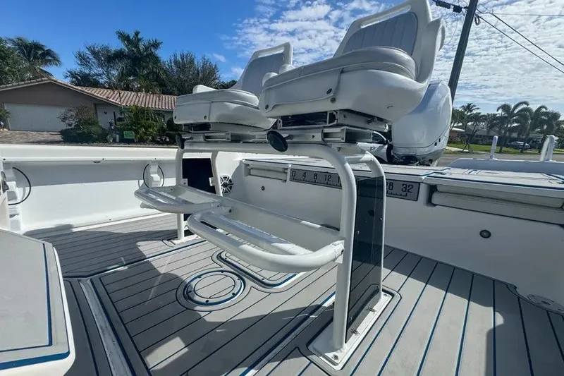 Slide: The Image of 2018 Blue Wave 2400 PureBay boat interior with dual seats and sleek deck design. - 61