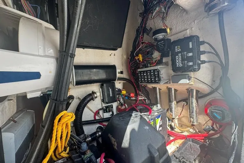 Slide: The Image of Interior view of a 2018 Blue Wave 2400 PureBay boat showing wiring and equipment. - 64