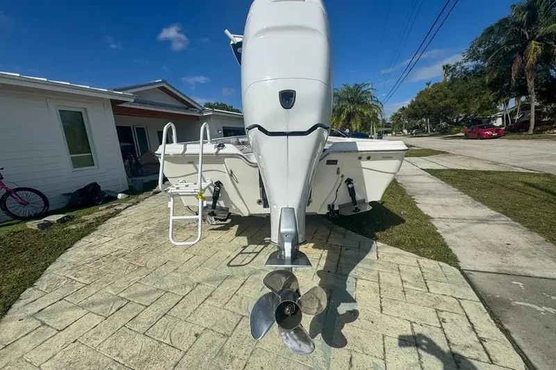 Slide: The Image of Rear view of a 2018 Blue Wave 2400 PureBay boat with outboard motor. - 8