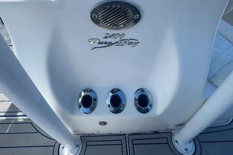 Slide: The Image of 2018 Blue Wave 2400 PureBay boat console with chrome fittings and logo. - 58