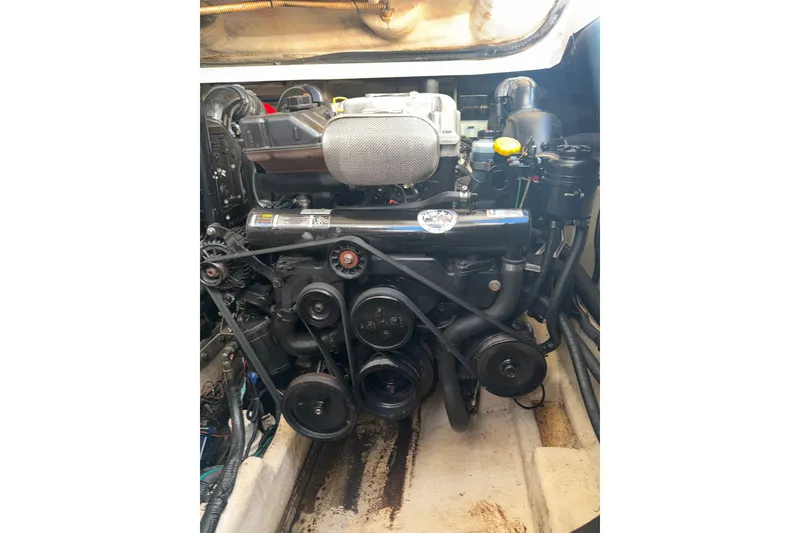 Slide: The Image of Engine compartment of a 2012 Sea Ray 335 Sundancer boat, showcasing mechanical components. - 21