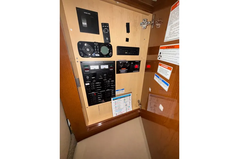Slide: The Image of Electrical control panel inside a 2012 Sea Ray 335 Sundancer boat cabin. - 20