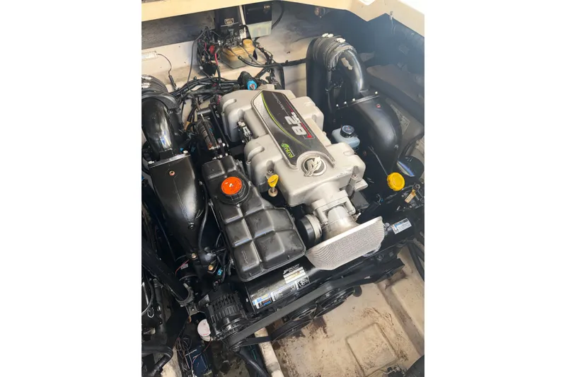 Slide: The Image of Engine of 2012 Sea Ray 335 Sundancer boat, showcasing detailed components. - 19