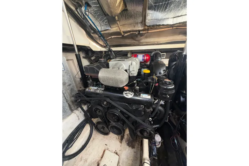 Slide: The Image of Engine compartment of a 2012 Sea Ray 335 Sundancer boat. - 16