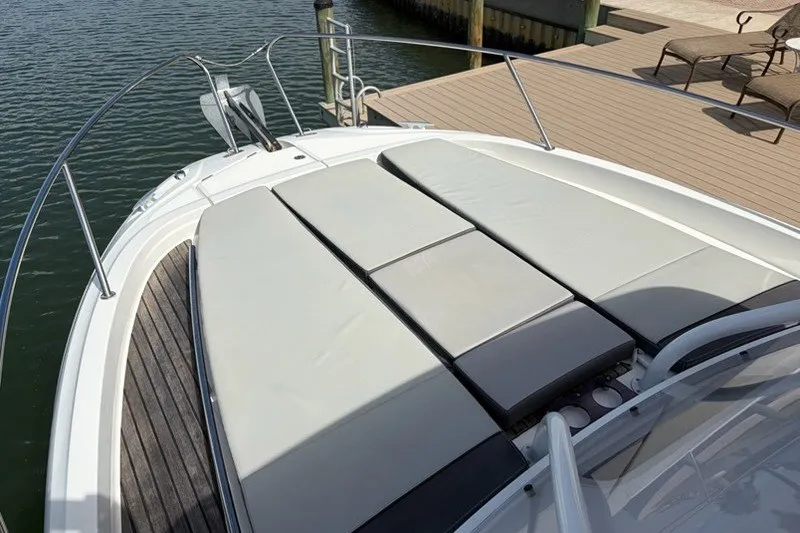 Slide: The Image of 2019 Jeanneau Leader 9.0 WA boat with spacious sunbathing deck by the water. - 19