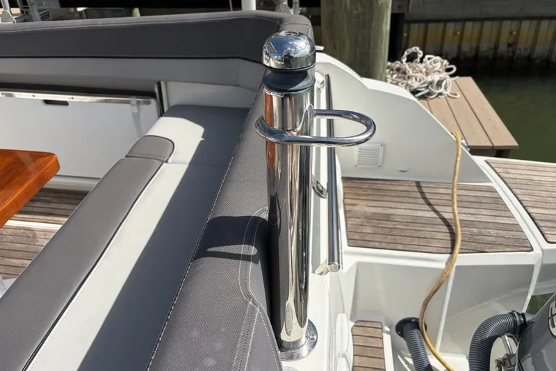 Slide: The Image of 2019 Jeanneau Leader 9.0 WA boat interior with sleek seating and polished metal details. - 4