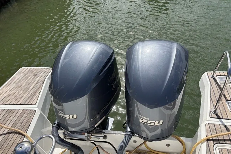 Slide: The Image of Twin Yamaha 250 outboard engines on a 2019 Jeanneau Leader 9.0 WA boat. - 2