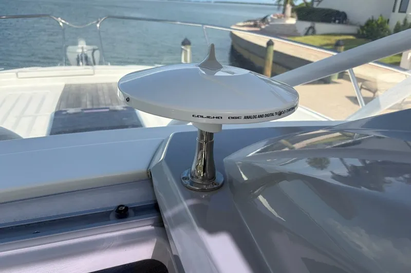 Slide: The Image of 2019 Jeanneau Leader 9.0 WA boat with a Calearo TV antenna, docked by the water. - 21