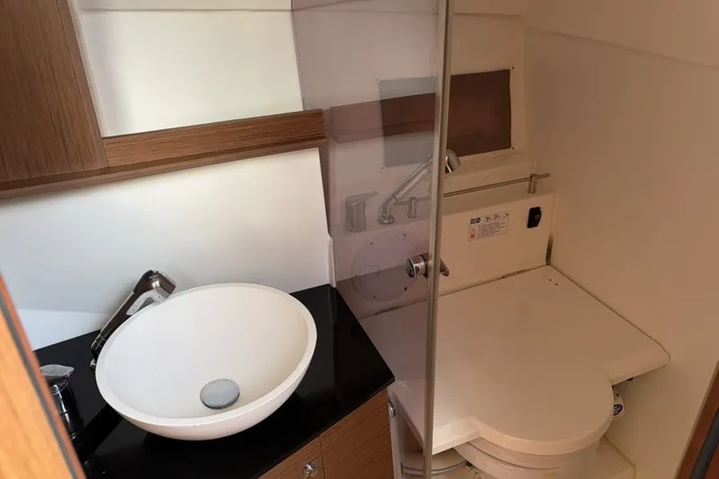 Slide: The Image of 2019 Jeanneau Leader 9.0 WA boat bathroom with modern sink and toilet. - 16