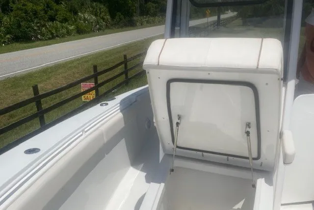 Slide: The Image of 2022 Sea Hunt Gamefish 27CB boat interior with open storage compartment. - 22