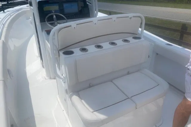 Slide: The Image of 2022 Sea Hunt Gamefish 27CB boat interior with seating and control panel. - 18