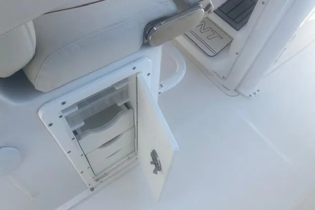Slide: The Image of 2022 Sea Hunt Gamefish 27CB boat interior with open storage compartment. - 20
