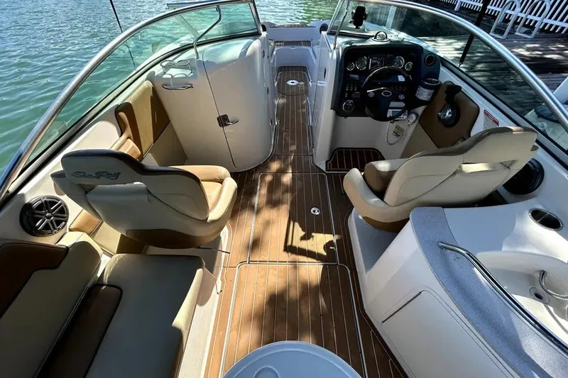 Slide: The Image of 2007 Sea Ray 260 Sundeck interior with elegant seating and modern dashboard. - 20