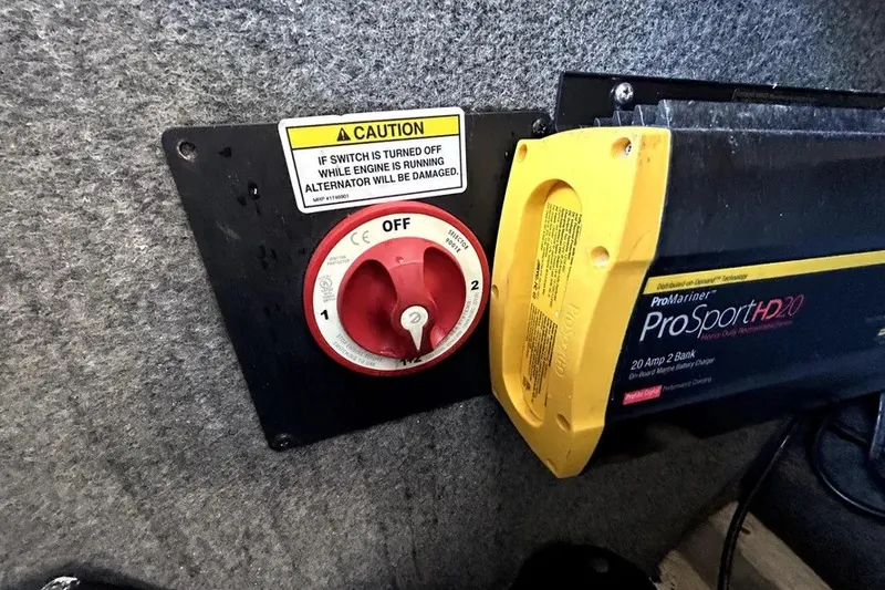 Slide: The Image of Battery switch and charger in a 2007 Sea Ray 260 Sundeck boat. - 49