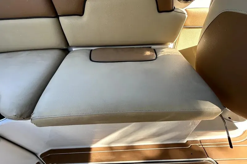 Slide: The Image of 2007 Sea Ray 260 Sundeck boat seat with beige and brown upholstery. - 54