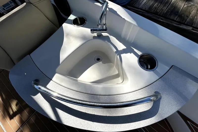 Slide: The Image of 2007 Sea Ray 260 Sundeck boat sink with faucet and cup holder. - 36