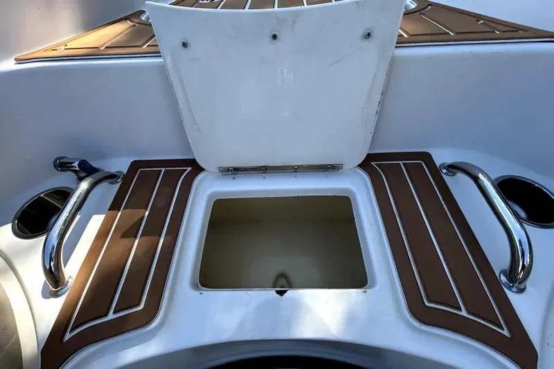 Slide: The Image of Open storage compartment on a 2007 Sea Ray 260 Sundeck boat deck. - 69