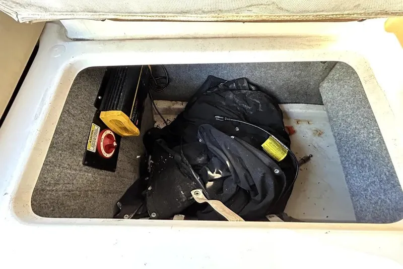 Slide: The Image of Storage compartment of a 2007 Sea Ray 260 Sundeck with equipment and gear. - 53