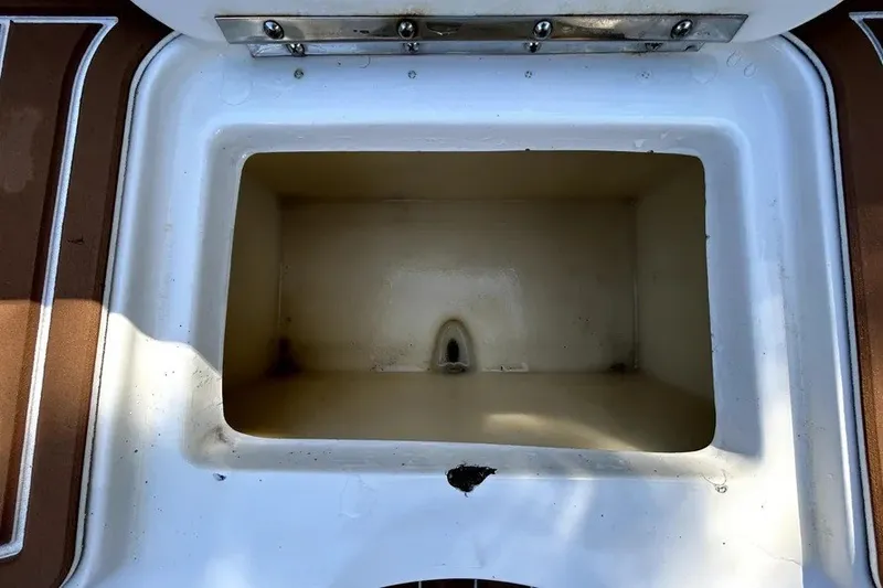 Slide: The Image of Open storage compartment on a 2007 Sea Ray 260 Sundeck boat. - 79