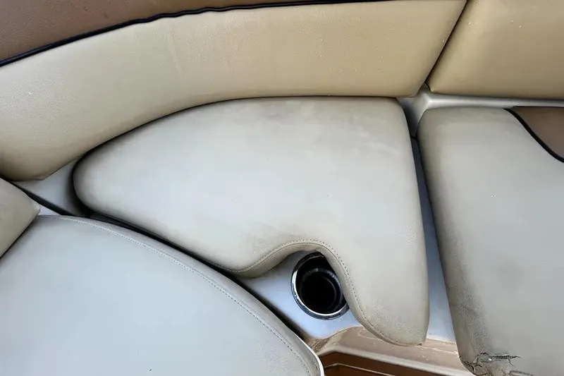 Slide: The Image of 2007 Sea Ray 260 Sundeck beige seating with cup holder detail. - 43