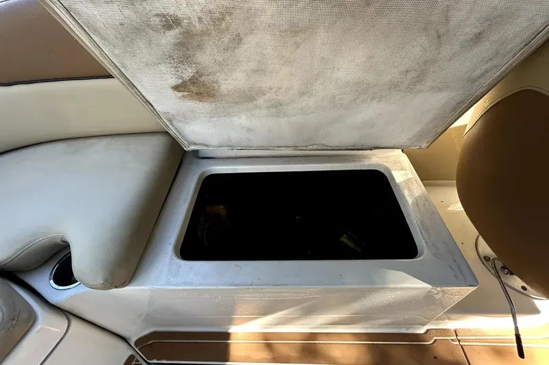 Slide: The Image of Storage compartment on a 2007 Sea Ray 260 Sundeck boat, open and empty. - 42