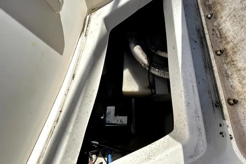 Slide: The Image of Engine compartment of a 2007 Sea Ray 260 Sundeck boat, showing hoses and components. - 37