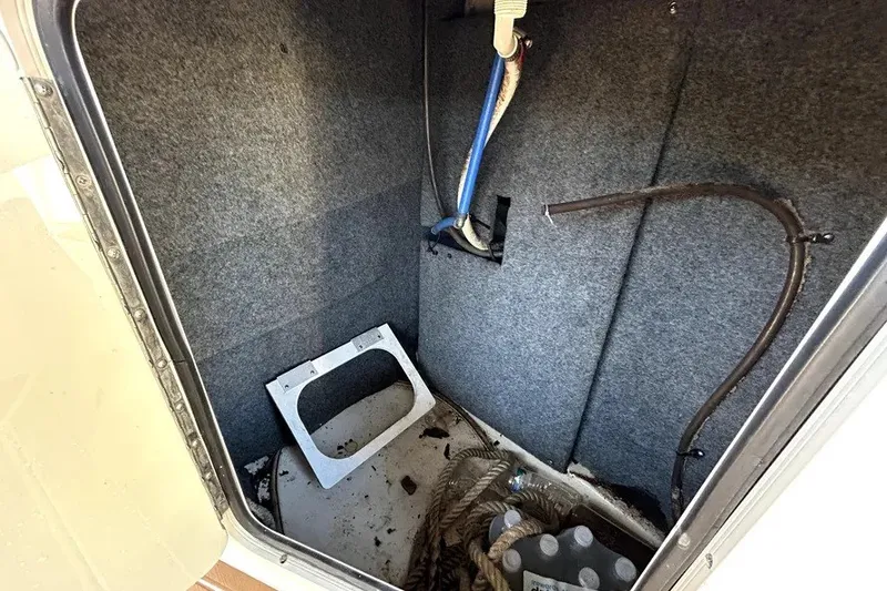 Slide: The Image of Interior storage compartment of a 2007 Sea Ray 260 Sundeck boat, showing cables and ropes. - 35