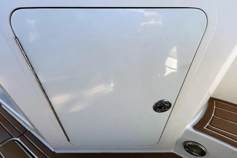 Slide: The Image of Hatch door on a 2007 Sea Ray 260 Sundeck boat, featuring sleek design. - 33